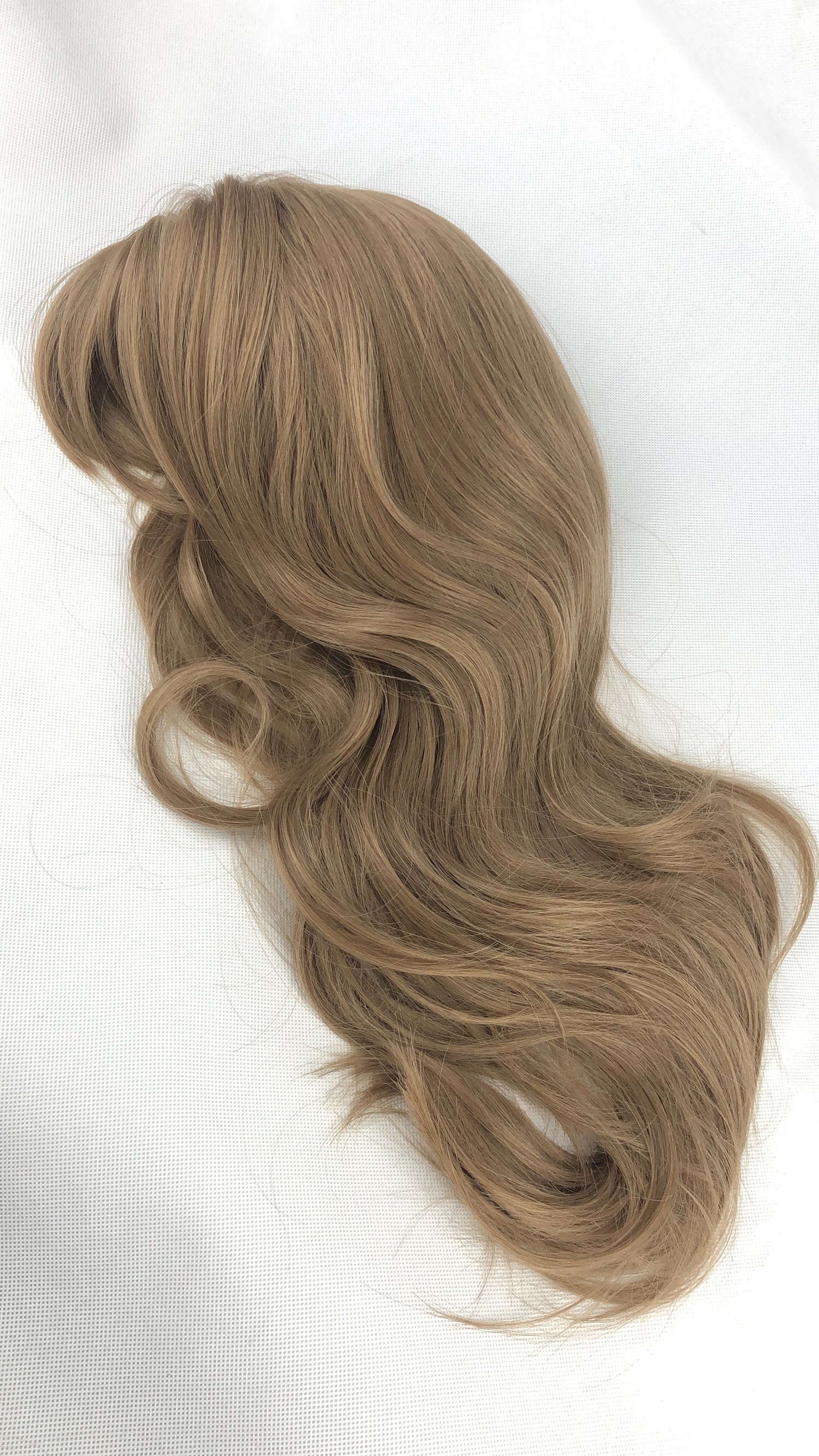 Image of various wigs showcasing the latest styles and colors from the 'New Arrivals' collection, highlighting their natural and comfortable fit.
