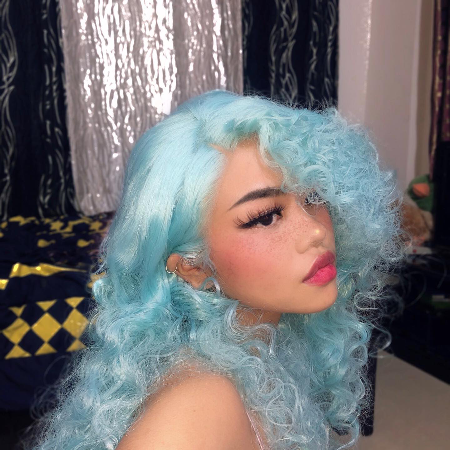 Image of various green wigs showcasing shades from mint to emerald, including the star wig 'Tiffany Blue,' from the 'Green Wigs' collection, perfect for a bold and vibrant look.